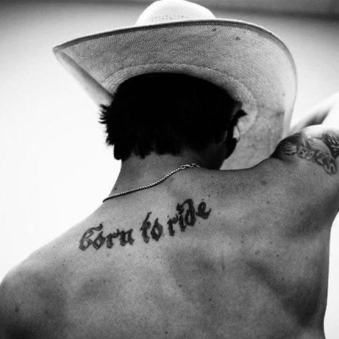Cowboy portrait, BORN TO RIDE tattoo