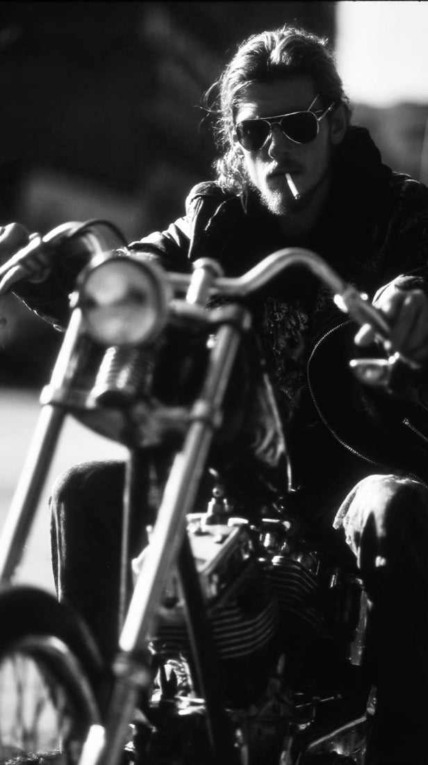 Solo rider, cigarette, aviators